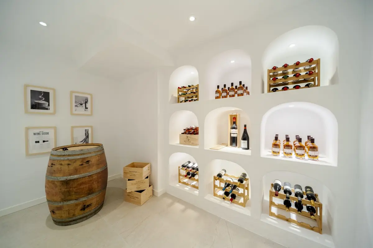 Wine cellar at Villa Zentosa with arched white niches